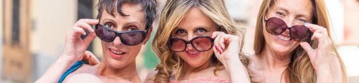 Three smiling women in sunglasses enjoying an active life in Frederick, MD
