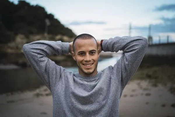 Smiling young man, representing complementary care for epilepsy
