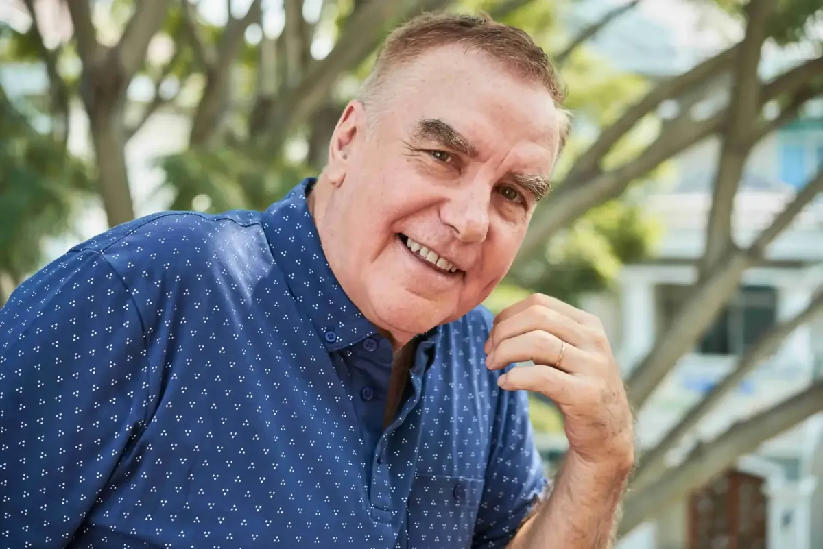 Smiling older man, representing supportive care for Parkinson's disease