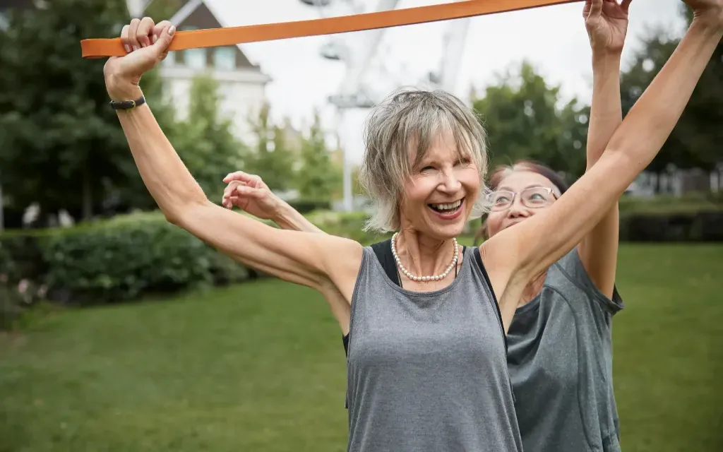 Women exercising together outdoors, representing women's health and wellness